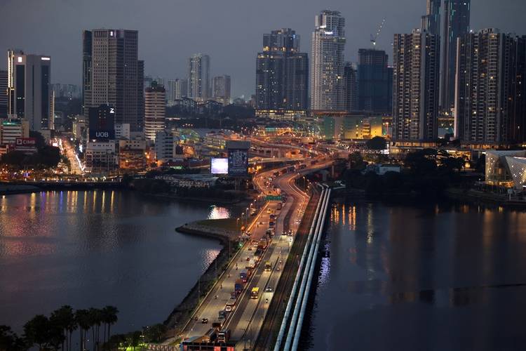 Skyscrapers of Johor Bahru city and traffic on the Singapore-Johore Causeway