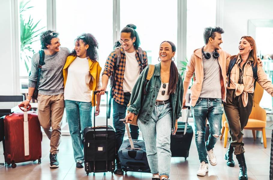  Millenial people doing check-in at hotel lobby