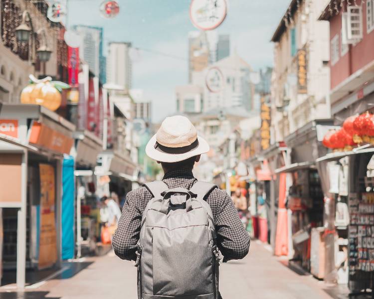 A tourist on a street in Singapore's Chinatown