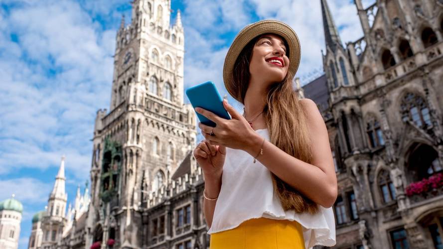 A woman in Europe planning a trip on her phone