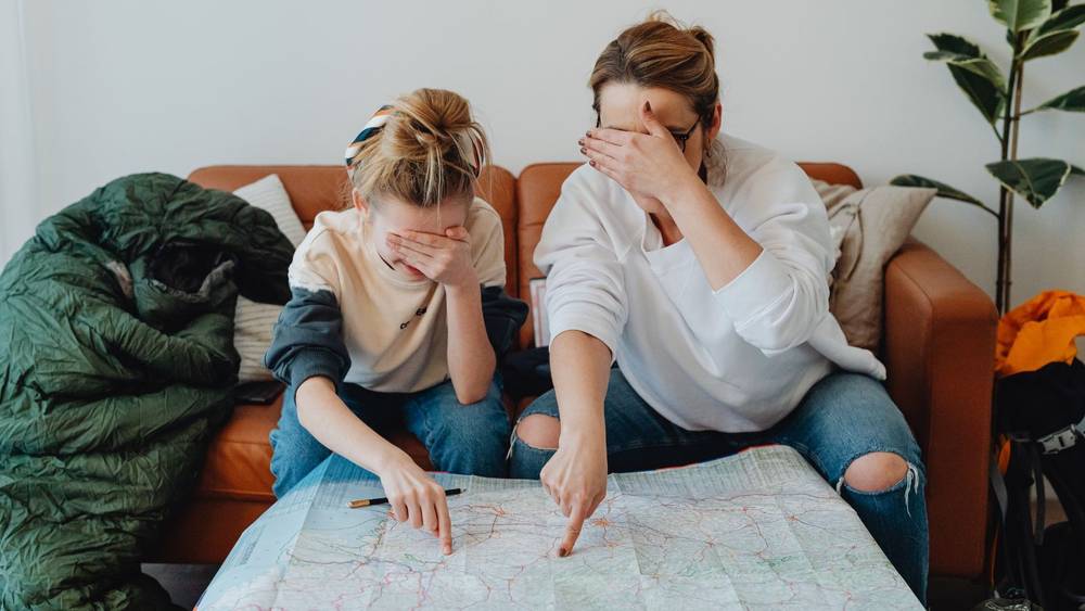 A family choosing a destination from a map.