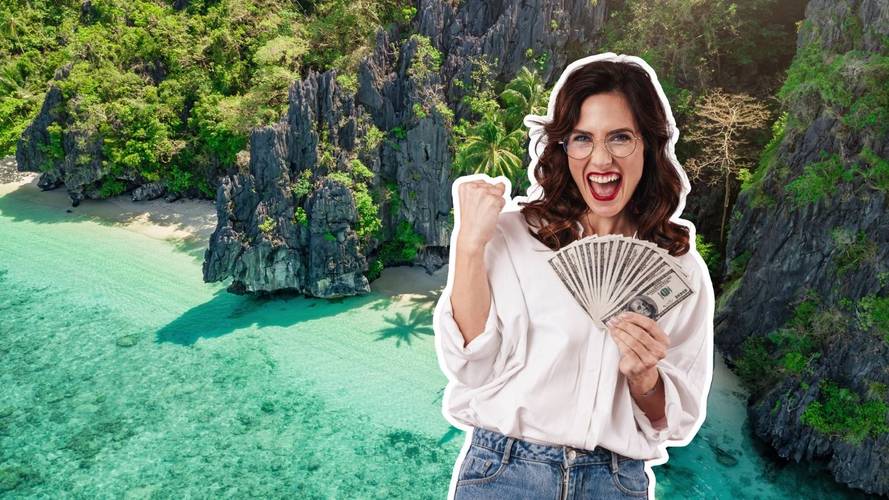 Woman holding money with a backdrop of a beach in the Philippines