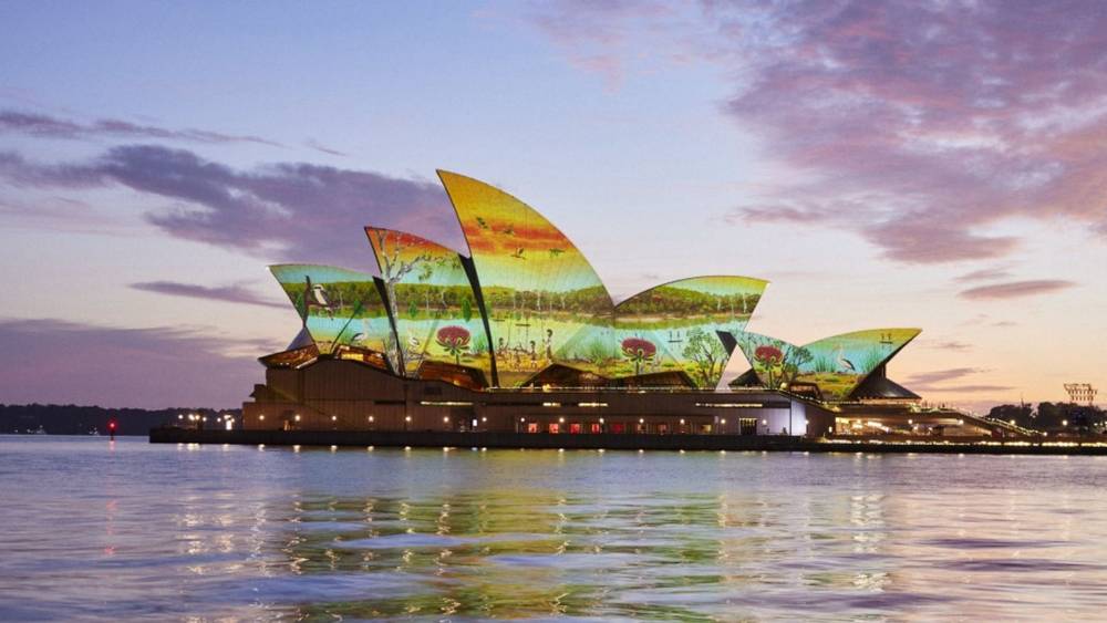 Aboriginal artwork being displayed on the Sydney Opera House sails at dawn