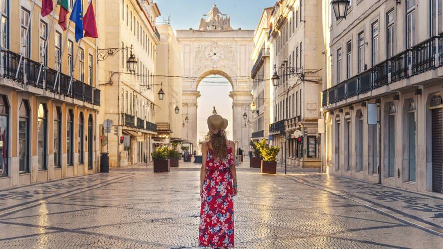A woman standing on a street in Europe