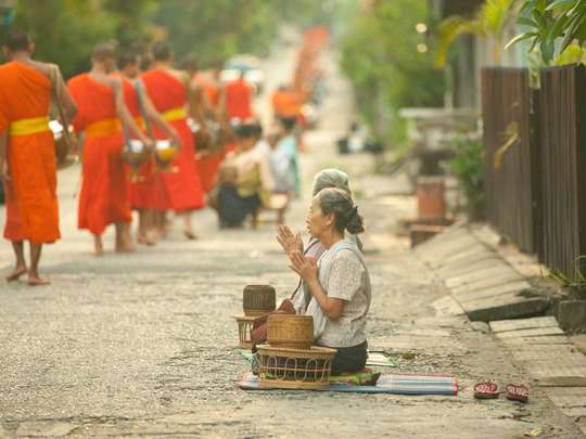 Luang Prabang Alms Giving and Kuang Si Waterfall Private Tour