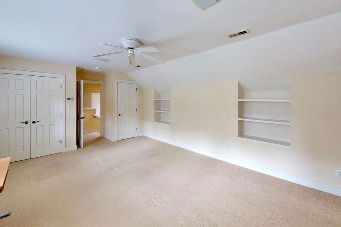 57 of 66. Second floor guest suite/3rd bedroom with private bathroom, walk-in closets and kitchenette.