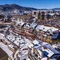 Snowy aerial view featuring a mountain view