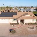 A rooftop shot highlighting the home's fully paid solar panels and 2018 roof upgrade. This energy-conscious property is a perfect example of sustainable living in Sun City West.