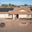 Highlighting the roof's solar panels and modern upgrades, this photo showcases the energy efficiency of this property, making it a standout choice in Sun City West.