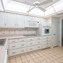 A well-appointed kitchen with plenty of counter space and natural light streaming in through the windows. Perfect for meal preparation and casual dining.