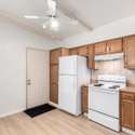 A timeless kitchen design featuring wood cabinetry, a tiled backsplash, and a spacious layout. Whether you're a home chef or enjoy casual cooking, this kitchen provides the perfect blend of charm and functionality in a prime Phoenix location.