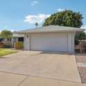 The spacious two-car garage and wide driveway provide ample parking for guests, vehicles, or a golf cart. A low-maintenance desert landscape completes this home s easy-living appeal.