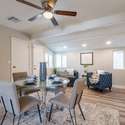 This modern dining space is bright and airy, with plenty of natural light, neutral decor, and stylish finishes. Ideal for intimate dinners or hosting guests.