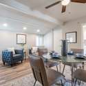 A versatile dining area that doubles as a cozy sitting nook. Featuring recessed lighting, stylish flooring, and ample space, this room is perfect for entertaining or unwinding.