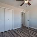 This modern bedroom boasts fresh flooring, a neutral color scheme, and a built-in closet for easy storage. Move-in ready and waiting for your personal touch.