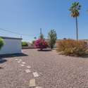This generously sized corner lot boasts a well-maintained, drought-friendly landscape with stunning desert plants. The open layout offers ample space for expansion, gardening, or simply enjoying the peaceful outdoor setting.