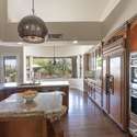 This kitchen impresses with rich custom cabinetry, granite counters, double wall ovens, and built-in refrigerator. Whether hosting or meal prepping, it s built for ease and luxury in every detail.