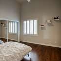 This dual-purpose guest room offers a Murphy bed, built-in California Closets workstation, and natural light perfect for remote work or weekend visitors.