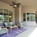 Relax in this tastefully furnished covered patio, offering plush seating and garden views. It s the ultimate shaded escape, enhancing the property s entertainment and comfort appeal.