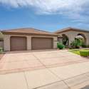 This well-maintained home includes a three-car garage and expansive driveway perfect for multiple vehicles, storage, or recreational gear. The low-maintenance landscaping and clean exterior enhance its overall appeal in a sought-after neighborhood.