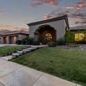 A full view of this home s front fa ade reveals its striking design, perfectly trimmed lawn, and upgraded lighting. This is an inviting, move-in-ready home located in a peaceful community.