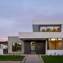 At golden hour, this Phoenix masterpiece stuns with its bold geometric design, expansive windows, and soft architectural lighting blending form, function, and style in the heart of Arcadia.