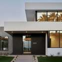 A clean-lined entryway welcomes you into this luxury Phoenix residence. With high-contrast details and statement architecture, it exemplifies desert-modern elegance near Arizona Country Club.