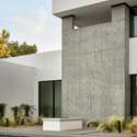 This modern corner view showcases flawless construction and dramatic contrast an artistic exterior moment that reflects the home s refined architectural aesthetic.