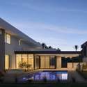The backyard comes alive at dusk, with soft lighting highlighting the pool s clean geometry. A picture-perfect setting for gatherings, relaxation, or luxury under the stars.