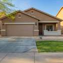 This single-story Laveen residence welcomes you with a clean, stucco exterior and a neatly manicured yard. Its simple yet stylish front elevation, combined with a tree-lined sidewalk, makes a lasting first impression.