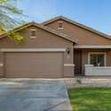 Step up to a warm, welcoming entry framed by modern stucco design, upgraded coach lights, and fresh desert landscaping. This home offers both charm and practicality for Phoenix living.