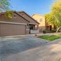 Enjoy the peaceful setting of this Rogers Ranch street, where tree-lined sidewalks and friendly neighbors define the lifestyle. The home s exterior blends seamlessly into the well-maintained community.