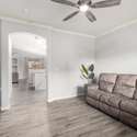With a graceful archway leading into the heart of the home, this layout invites entertaining and easy movement. Stylish flooring and neutral colors offer a blank canvas for your personal style.