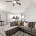 Enjoy open-concept living with this expansive family room that connects directly to the kitchen and dining area. Updated flooring, fresh paint, and LED recessed lighting make this a warm and energy-efficient space for any lifestyle.