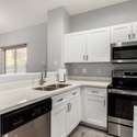 This freshly updated kitchen includes shaker cabinets, a full appliance suite, and expansive countertop space. It's a well-organized hub for culinary creativity and modern convenience.