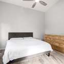 This large owner s suite offers neutral tones, high ceilings, and space for a full bedroom set. It s a peaceful escape within the home, ideal for rest and recharging in a quiet Rogers Ranch neighborhood.