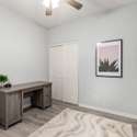 A charming wood sliding door adds privacy to this flexible office area. Ideal for remote work or hobbies, this room is tucked away for focus while still connected to the home s flow.