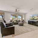 This expansive great room is designed for comfort and relaxation, with stunning views of the Desert Springs Golf Course just beyond your windows. Natural light, soft hues, and wide-open space invite peaceful living and stylish gatherings.