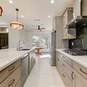 From double wall ovens to upgraded hardware and tile accents, this remodeled kitchen exudes thoughtful craftsmanship. Sleek cabinetry and quartz surfaces deliver style and durability in one of Surprise s most elegant homes.