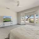 This oversized bay window brings in natural sunlight and panoramic golf course scenery. It s a standout architectural feature that enhances both the beauty and the ambiance of the primary bedroom.