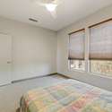 Designed for relaxation, this versatile bedroom features two large windows, custom blinds, and clean finishes perfect as a bedroom, den, or reading nook.