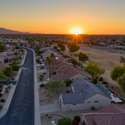 Gaze down this peaceful Surprise street at golden hour with panoramic sunset views stretching across the community. A picture-perfect setting to call home.
