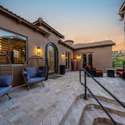 This inviting courtyard offers privacy and charm with paver stone flooring, designer lighting, and relaxing outdoor seating. A peaceful Scottsdale space perfect for coffee mornings or evening cocktails.