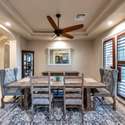 Create lasting memories in this refined formal dining room, complete with tray ceilings, recessed lighting, and oversized shuttered windows. A perfect space for holidays and upscale dinners.