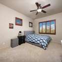 A peaceful space with bright natural light, neutral tones, and wood-shuttered windows. This bedroom offers comfort and flexibility within the well-designed Scottsdale floor plan.