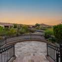 From the elevated front patio, enjoy uninterrupted views of the surrounding Scottsdale landscape and neighborhood. This stone-tiled overlook is ideal for soaking in the desert's golden hour and appreciating the property s peaceful, private setting.