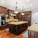 Interior Photo - 846 Armstrong Rd - Photo of Chef's Kitchen with oversized Island, custom cabinetry, double wall ovens.