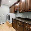 Interior Photo - 846 Armstrong Rd - Photo of Laundry Room, tons of custom cabinets, which also includes sink.