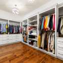 Interior Photo - 846 Armstrong Rd - Additional Photo of Primary Closet showcasing extensive custom closet cabinetry and organization.