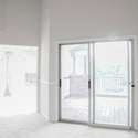 View of Sunroom and door to Screened-in porch from the living room.